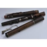 A 19th century rosewood flute, by Simpson, London, in four sections,