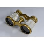 A pair of French mother-of-pearl and gilt-brass opera glasses, 10.