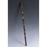 A 19th century Chinese hardwood and mother-of-pearl ruler, inlaid with flowers and scrolling leaves,