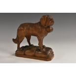 A Black Forest carving, of a St Bernard dog, he stands, a barrel at his collar,