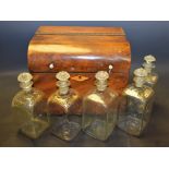 A Biedermeier mahogany domed decanter box, the hinged cover with turned bone handles,