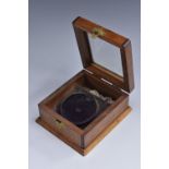 An early 20th century mahogany rounded rectangular pocket watch box,