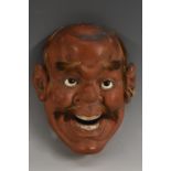 A Japanese lacquer Noh mask, typical caricatured features, applied with hair, 26cm long,
