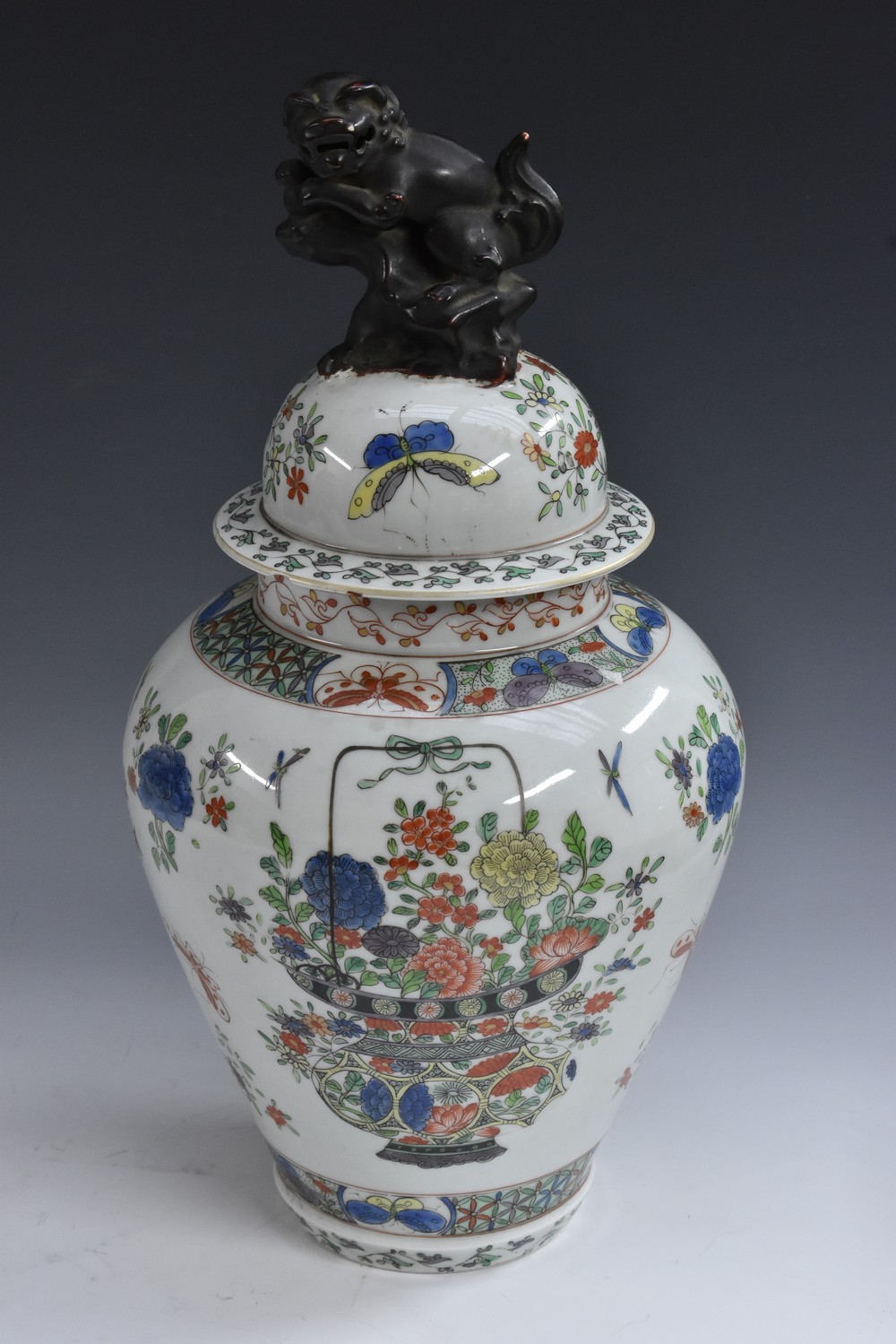A 19th century French famille verte ovoid temple jar and cover,
