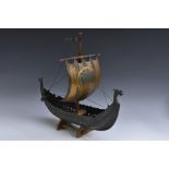 A Scandinavian bronze Viking ship, the main sail with a wrigglework eagle, oak mast,