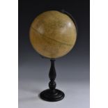 A 10" terrestrial globe, the Phillip's Challenge Globe, turned ebonised base,