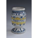 A South European tin glaze apothecary albarello, inscribed Charitas, 15cm high,