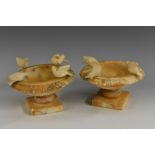 A pair of Italian Grand Tour models, of the Capitoline or Pliny Doves, square bases, 12.