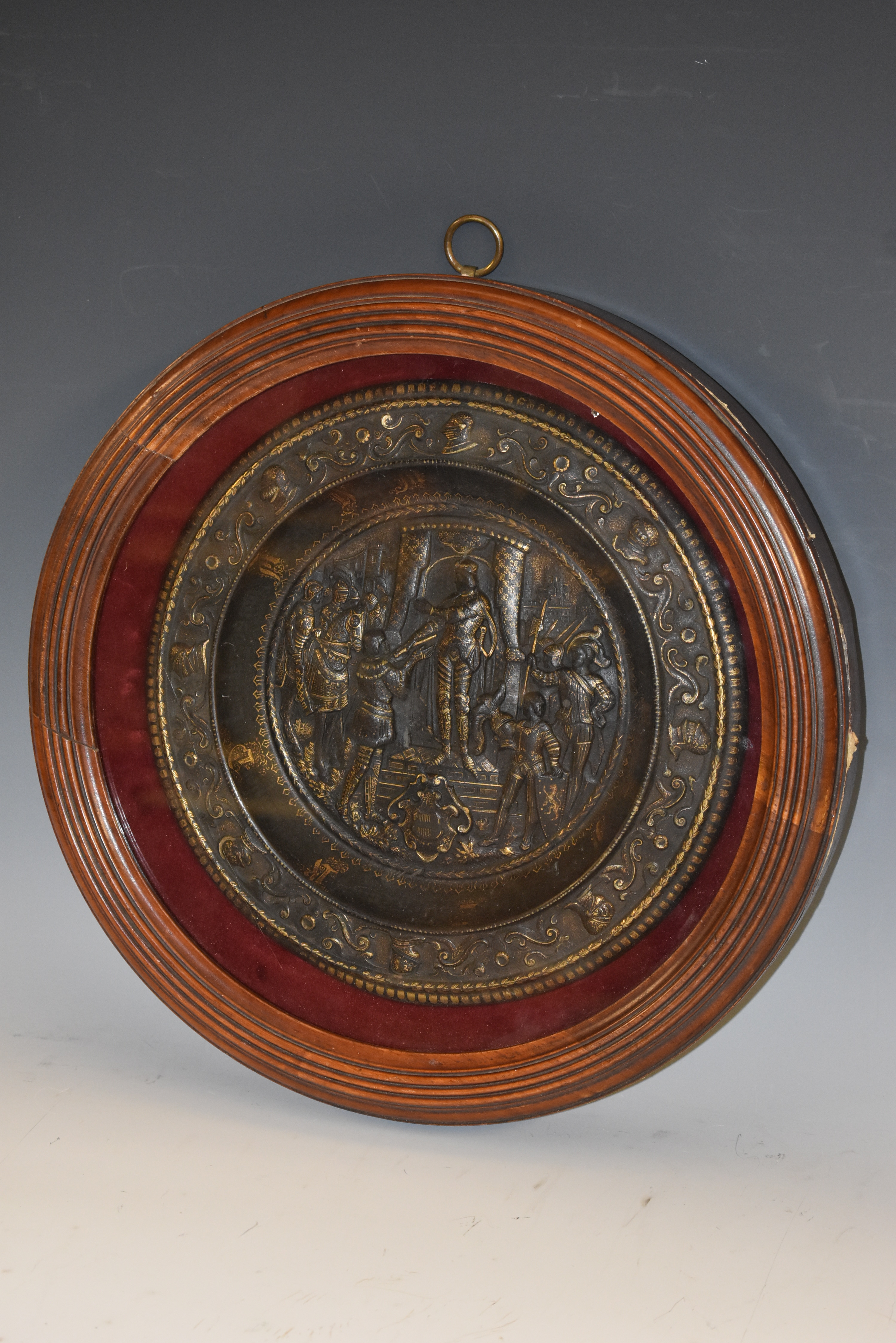 A 19th century Historicist dark patinated circular plaque,