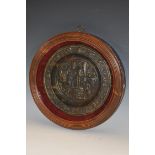 A 19th century Historicist dark patinated circular plaque,