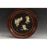 A large Japanese shibayama and lacquer charger, applied in ivory and mother of pearl with figures,
