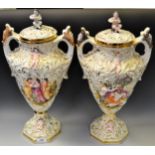 A pair of Capodimonte Neapolitan Keramos twin handled urns with covers, a faun,