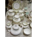 A Royal Doulton Isabella pattern dinner service, comprising seven dinner plates,
