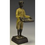 A contemporary cold painted bronze of a footman carrying a tray.
