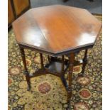 A Victorian mahogany octagonal table, turned legs, shelf stretcher, casters, 63cm wide, 72cm high,