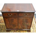 A reproduction mahogany side cabinet, two short drawers over two door cupboard.