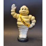 Advertising - a cast metal figural money bank, as Bibendum, the Michelin Man,