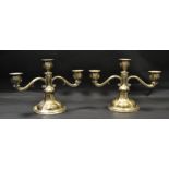 A pair of 830S, silver two branch table candlesticks,