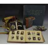Boxes and objects- voltmeter, 1966 World Cup poster, ogdens cigarette cards,