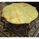 A gilt metal and onyx serpentine circular coffee table,