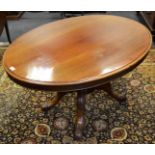 A Victorian mahogany oval breakfast/loo table, turned legs, scroll legs, c.