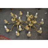 A pair of brass seven branch chandeliers