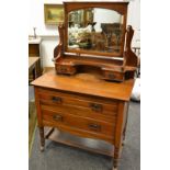 A mahogany dressing table, arched mirror, two drawers and shelf to superstructure,