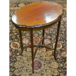 An Edwardian mahogany shaped oval side table, inlaid with boxwood stringing, slightly splayed legs,