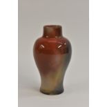 A Bernard Moore inverted baluster flambé glazed vase, splashed with iridescent greens,
