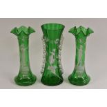 A pair of Mary Gregory green glass slender flower vases,