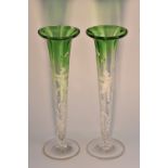 A pair of Mary Gregory green flashed trumpet shaped specimen vases,