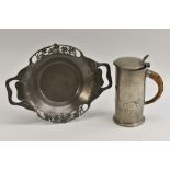 A Liberty & Co pewter jug, after a design by Archibald Knox, embossed with flowing sinuous stems,