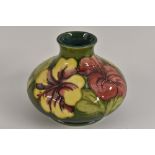A Moorcroft Hibiscus pattern compressed ovoid vase,