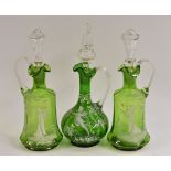 A pair of Mary Gregory green decanters,