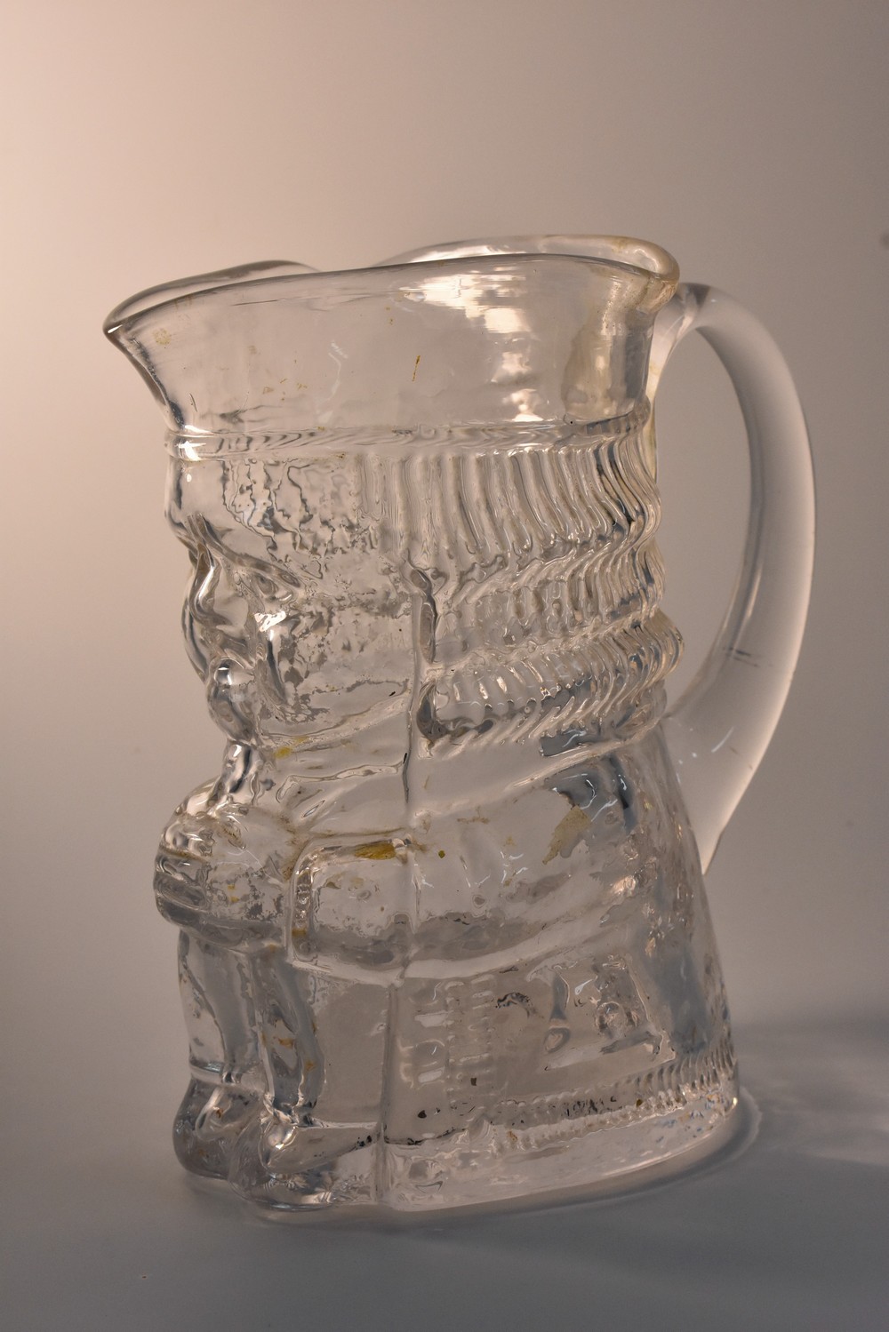 A Whitefriars clear glass Toby jug, Adam,