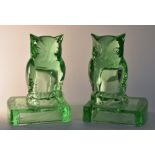 A pair of late Victorian green glass bookends modelled as owls, Reg. No. 798842, approx. 14.