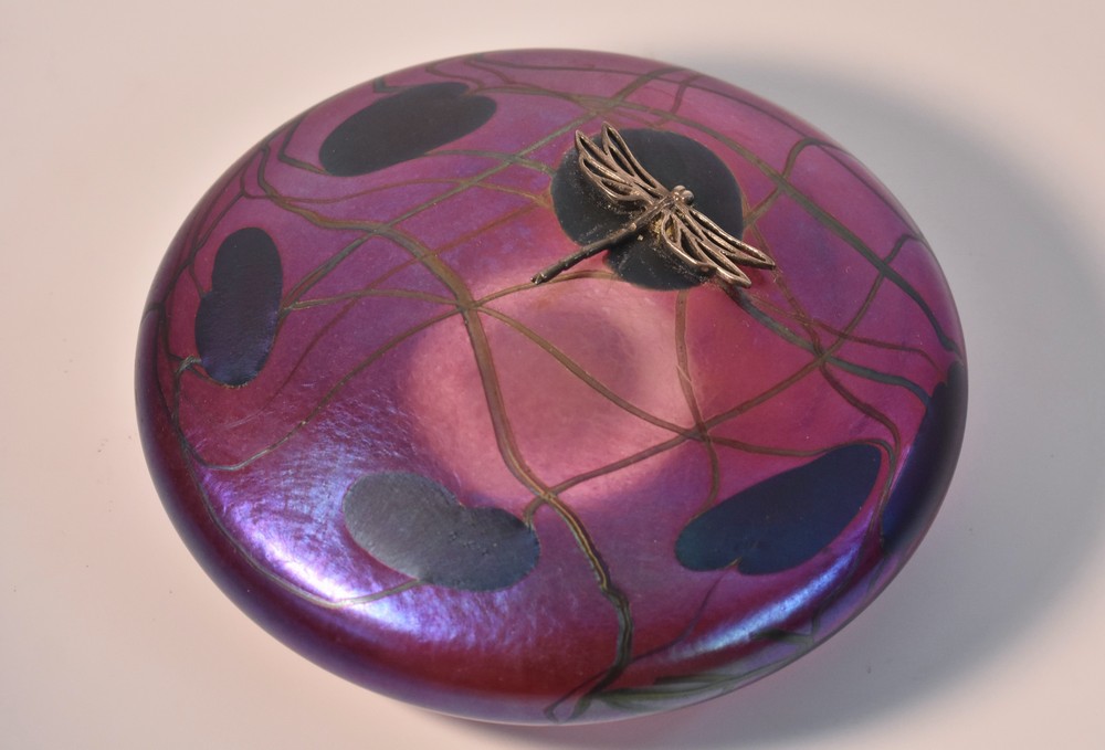 A John Ditchfield Glasform Dragonfly pebble paperweight, the white in lilac and purple with lilies,