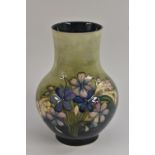 A Moorcroft Spring Flowers baluster vase, tube lined with flowers and foliage in blue and pink,