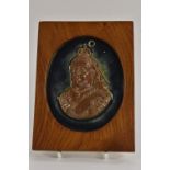 A Doulton Lambeth plaque, sculptured by John Borad, Queen Victoria, in tan, on a blue ground, oval,