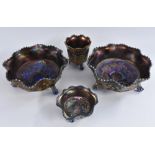 Carnival Glass - a pair of purple lustre Butterflies and Berries bowl, wavy edge,