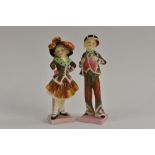 A pair of Royal Doulton figures, Pearly Boy and Pearly Girl, pink square bases, 13.