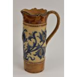 A Royal Doulton cylindrical jug, designed by Mark V Marshall, incised with stylised thistles,