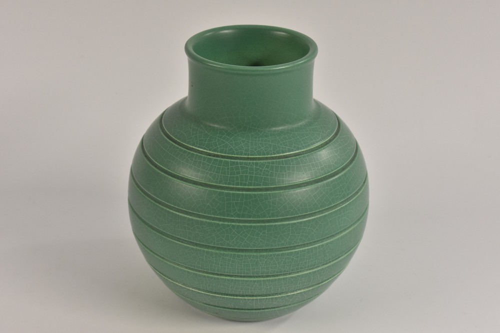 A Keith Murray ribbed green glazed globular vase, 17cm high,