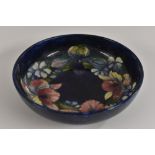 A Moorcroft Orchid pattern bowl, tube lined with large flowerheads and foliage,