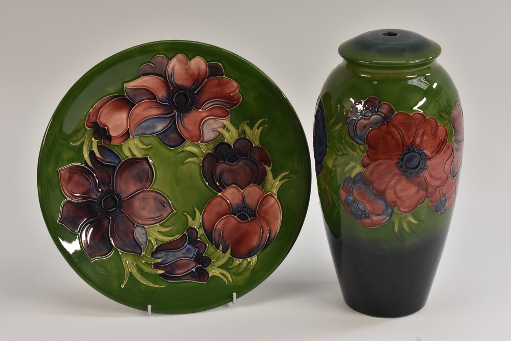 A Moorcroft Anemone pattern ovoid lamp base, tube lined with large flowerheads in blue and red,