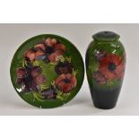 A Moorcroft Anemone pattern ovoid lamp base, tube lined with large flowerheads in blue and red,