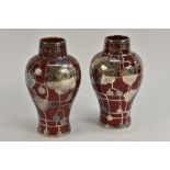 A pair of Bernard Moore inverted baluster vases, flambé glazed,