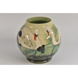 A contemporary Moorcroft Swan pattern vase, designed by Sally Tuffin,