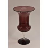 A late 19th century amethyst glass pedestal vase, outswept bucket shaped bowl, clear glass stam, 37.