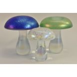 A John Ditchfield Glasform mushroom, in iridescent blue, 14cm; two others similar smaller,